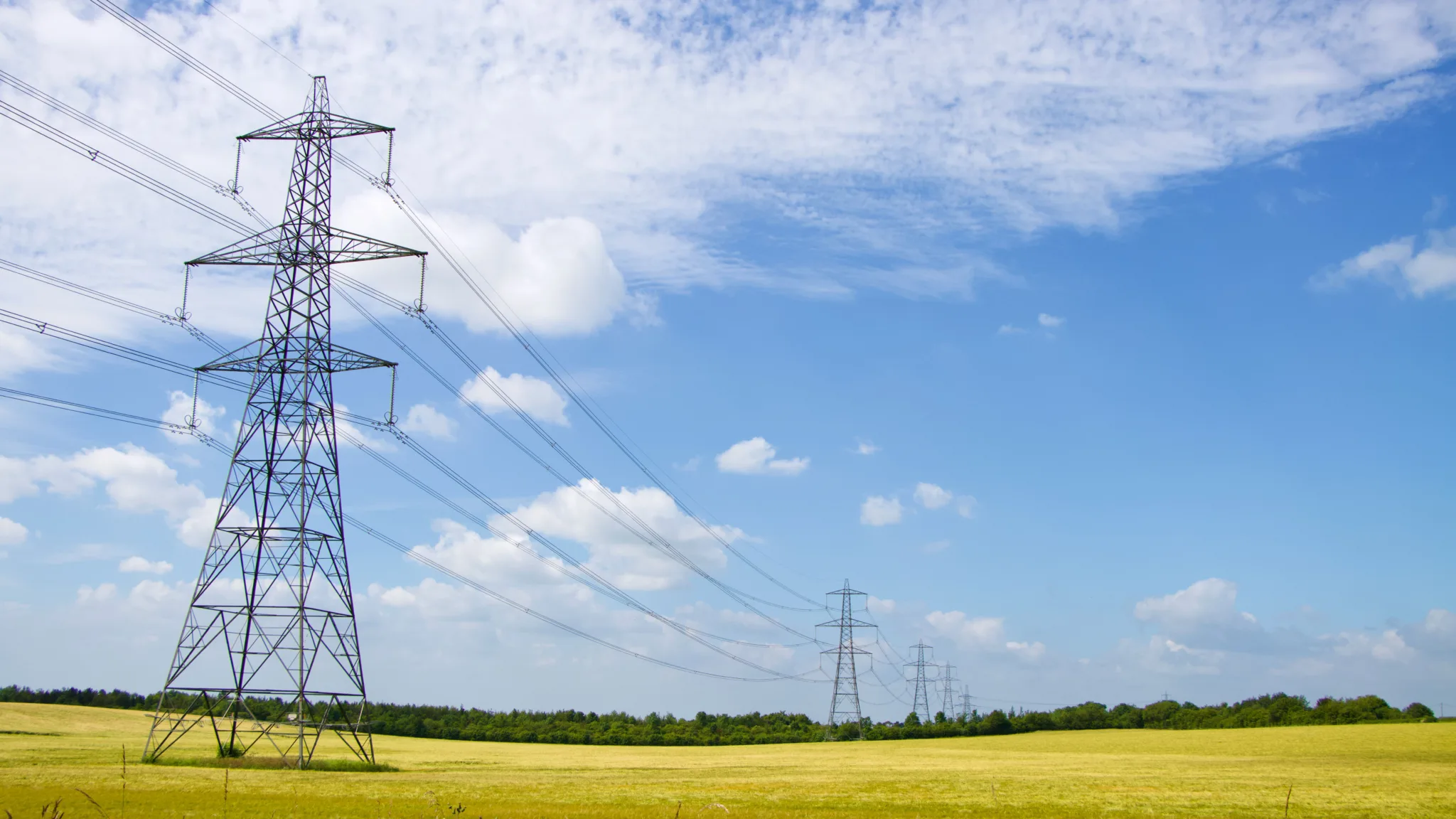Power pylons in a green field, England